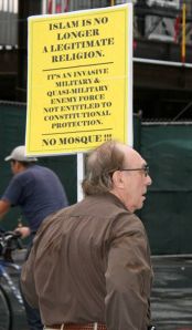 Man carrying Islam protest sign